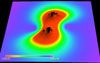 Snapshot showing the field representing
	gravitational wave generated from an inspirallying black hole binary at time equals 9